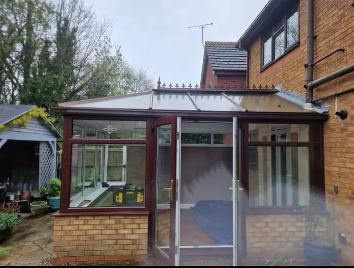 Conservatory with its old glass roof, before the work