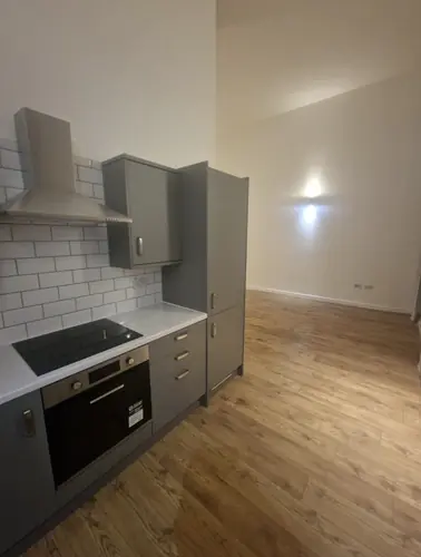 Rental flat kitchen with oven, hob and metro tiles