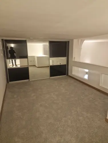 Bedroom in the rental flat with mirrored wardrobes