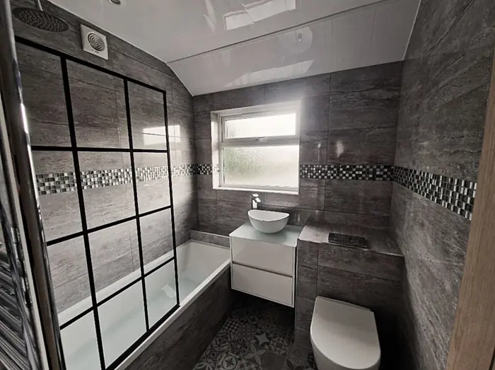 Bathroom with a black-framed shower screen and vessel basin