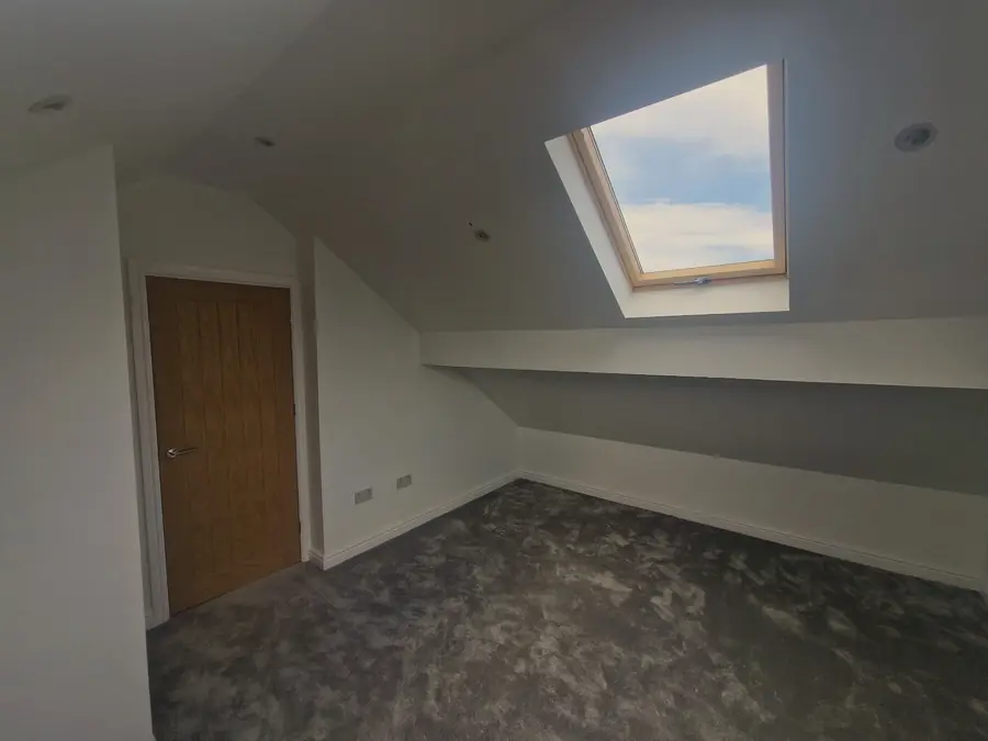 Loft room with two roof windows and oak doors